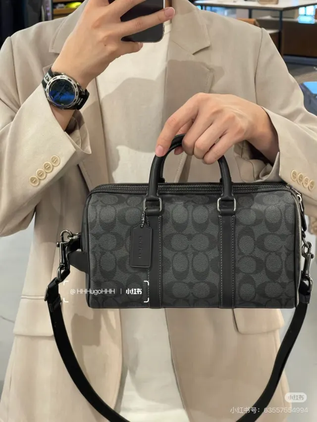 Coach Venturer 27 Satchel, black and grey — hand-carry view