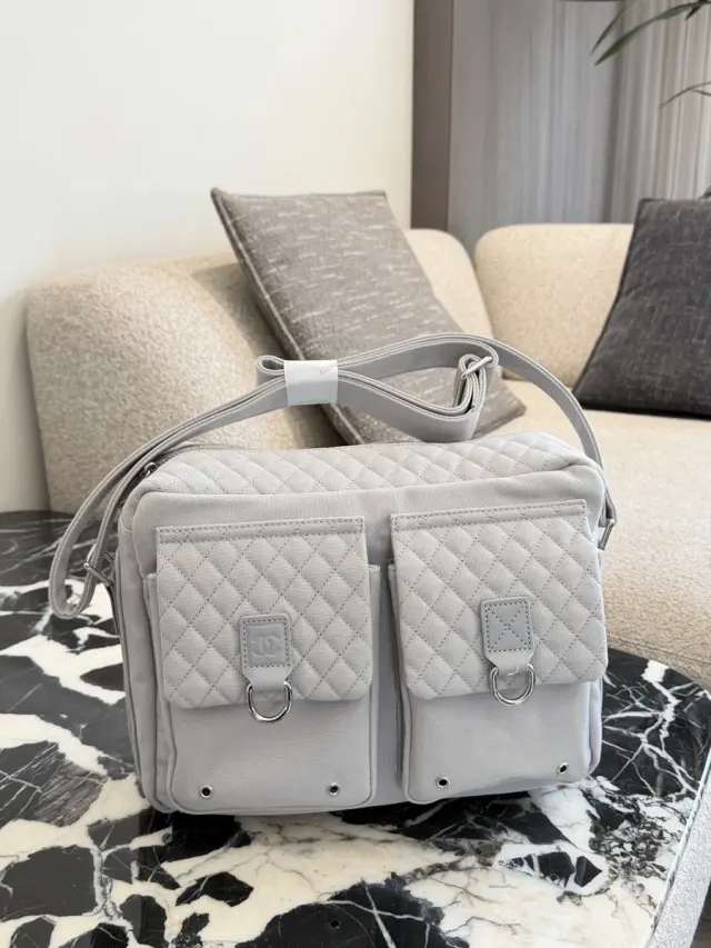 Chanel Quilted Messenger Bag in Leather — 30 cm — source photograph 1 of 3