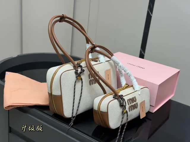 Miu Miu Canvas Crossbody Bag — 35 × 22 cm Options — source photograph 1 of 3