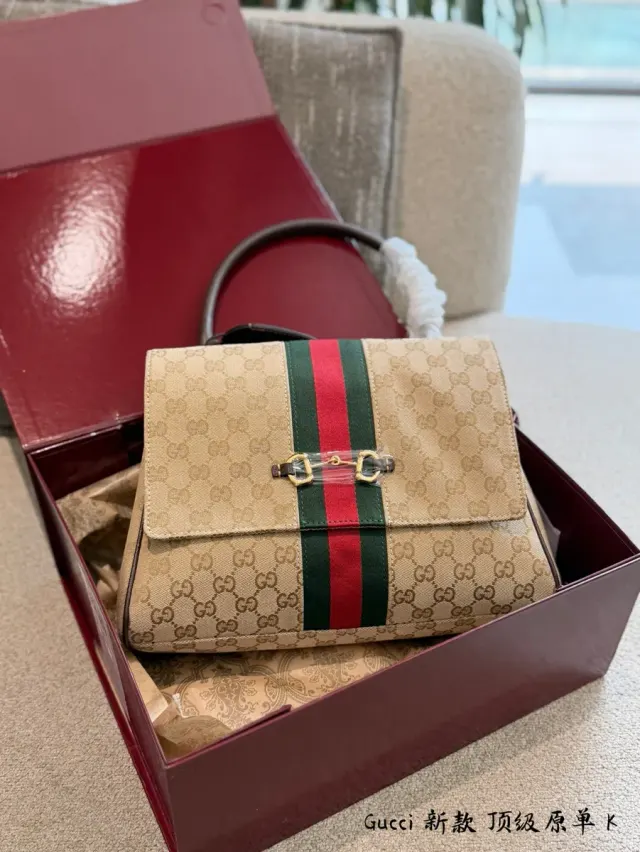 Gucci Paparazzo Monogram Canvas Crossbody Bag — 30 cm — source photograph 1 of 3