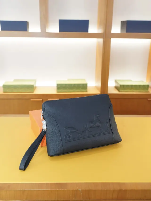 Hermès Clutch Bag in Cowhide Leather — source photograph 1 of 3