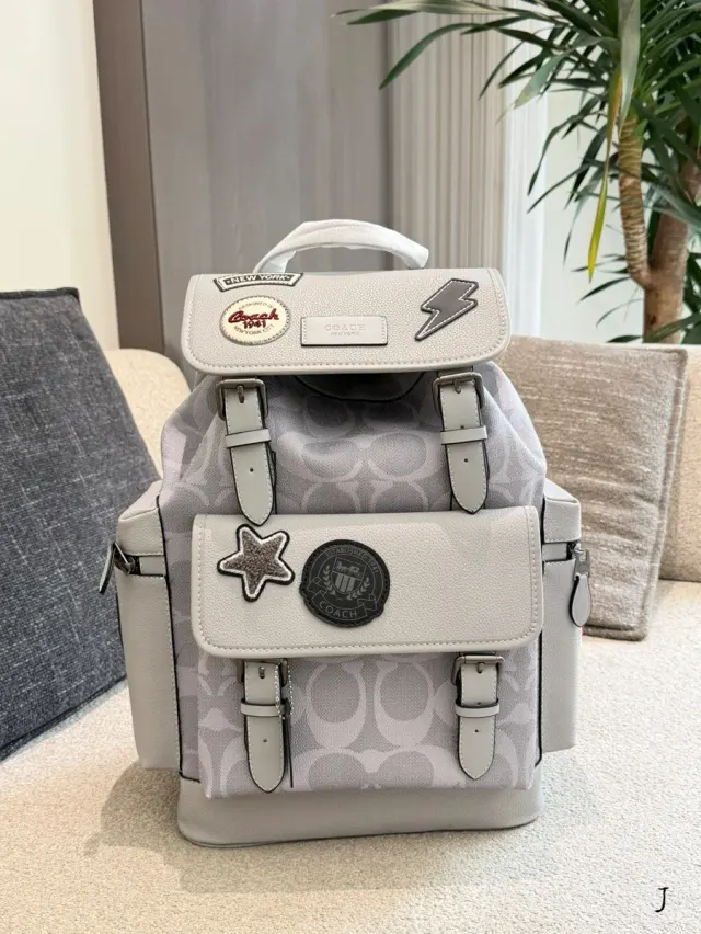 Coach Canvas Printed Backpack — 29 × 45 × 16.5 cm — source photograph 1 of 3