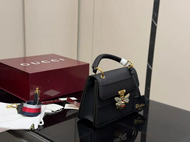 Gucci Margaret Messenger Bag in Leather — 25 × 18 cm — black reference with striped strap pictured