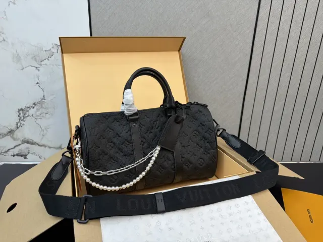 Louis Vuitton Keepall 35 Monogram Travel Bag in Leather — 35 cm — source photograph 1 of 3