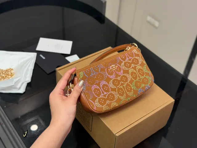 Coach Nolita 19 Shoulder Bag, tan with multicolour pattern — front patterned view