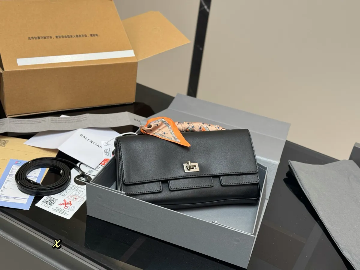 Balenciaga Clutch Bag - 28 × 14 cm — source photograph 1 of 3