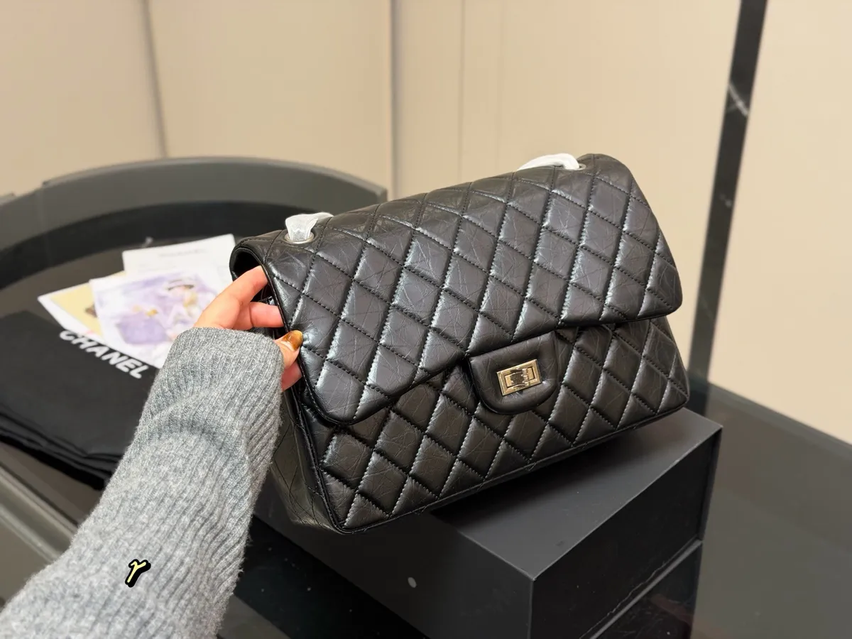 Chanel 2.55 Chain Handbag - 30 × 28 cm — source photograph 1 of 3