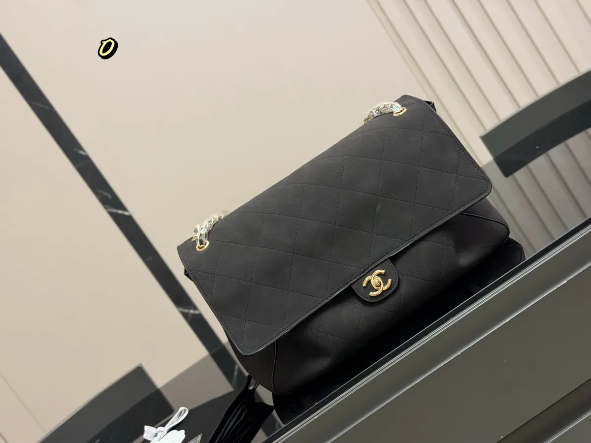 Chanel Classic Flap Handbag - 40 × 26 cm — source photograph 1 of 3
