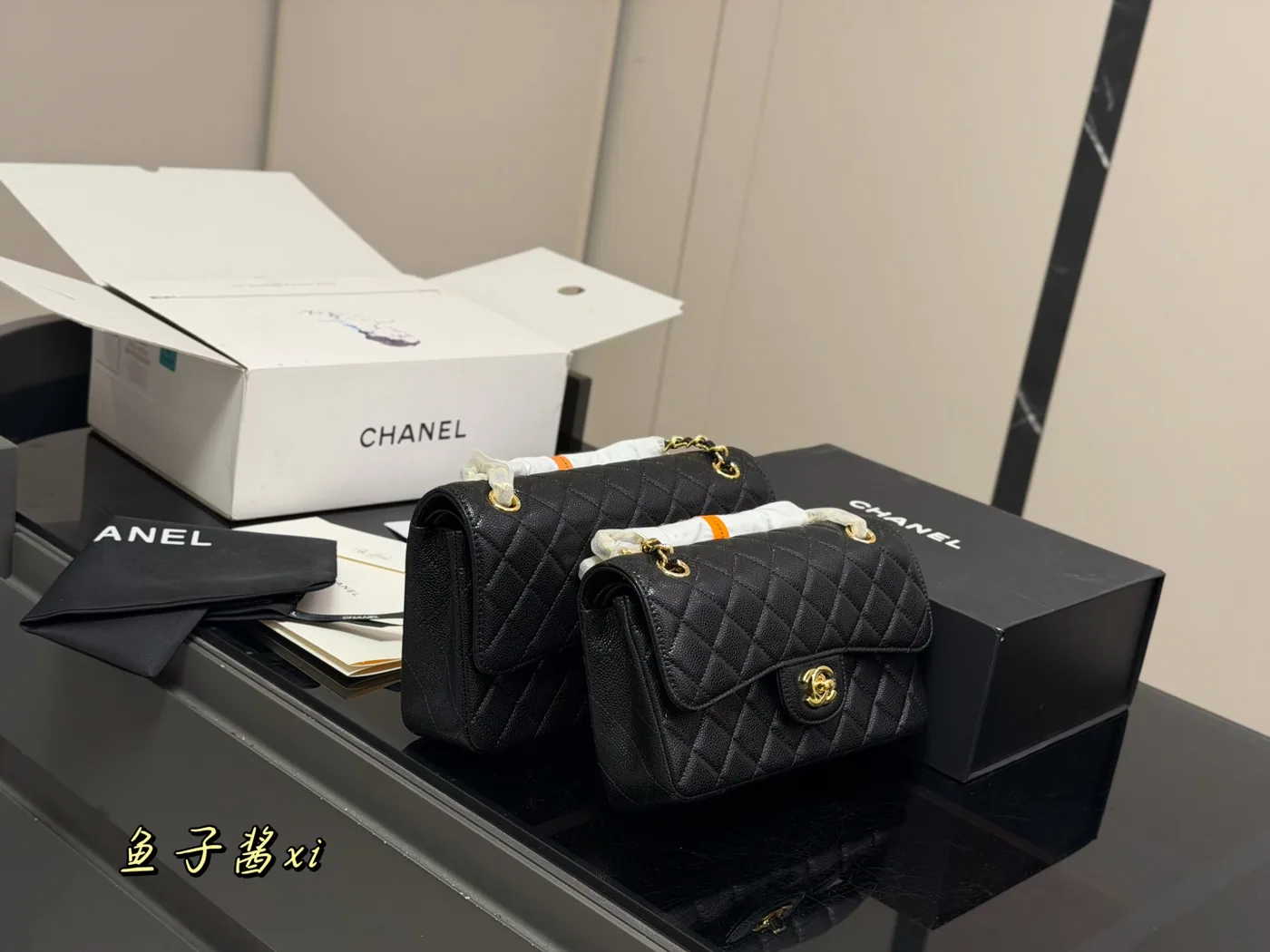 Chanel Classic Flap Shoulder Bag, black, gold-tone hardware — size comparison