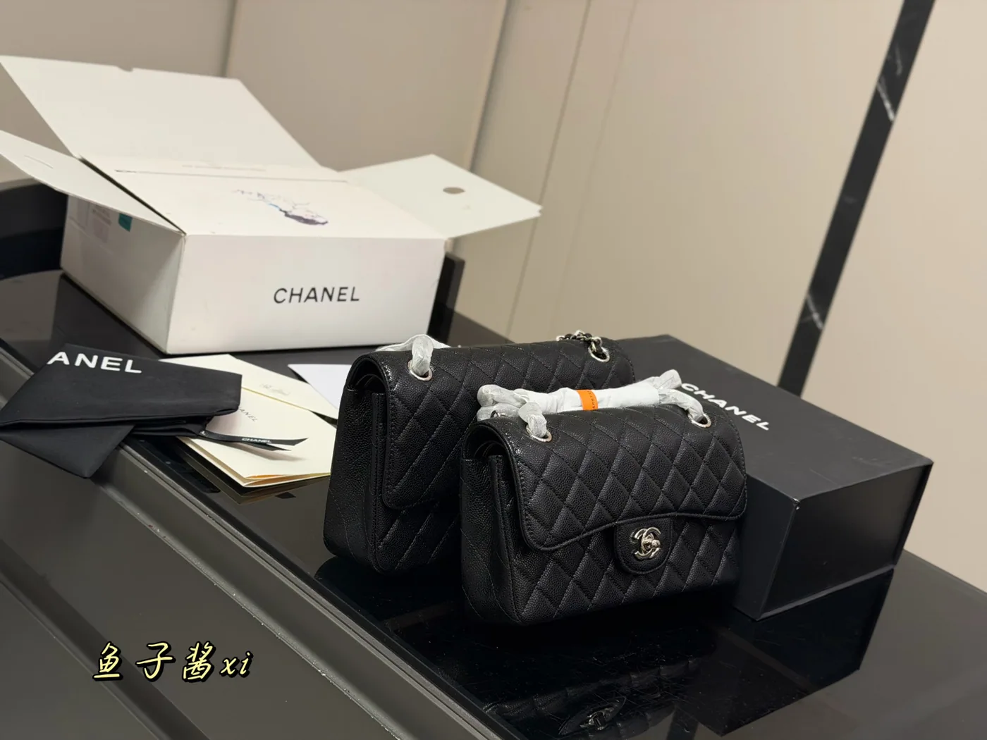 Chanel Classic Flap Shoulder Bag, black, silver-tone hardware — size comparison