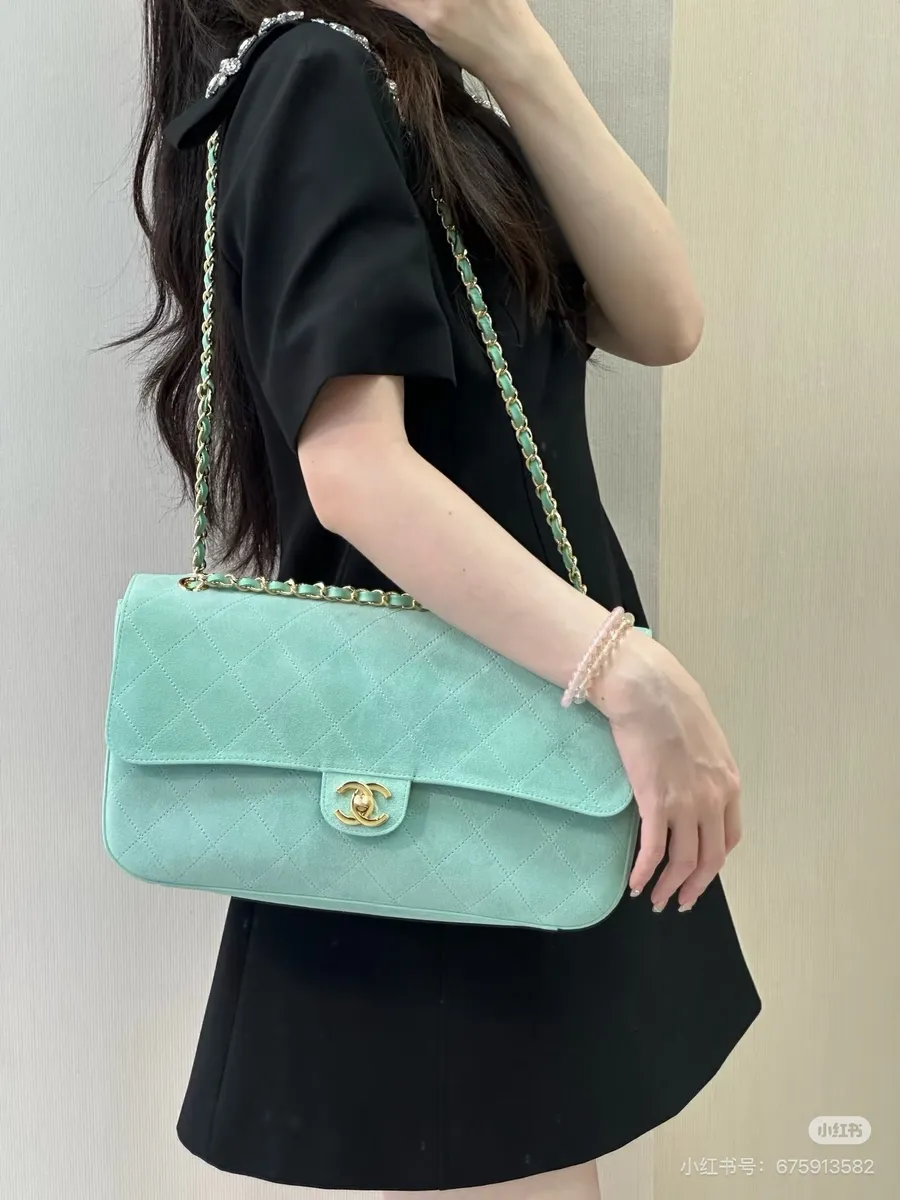 Chanel Maxi Suede Quilted Handbag — source photograph 1 of 3