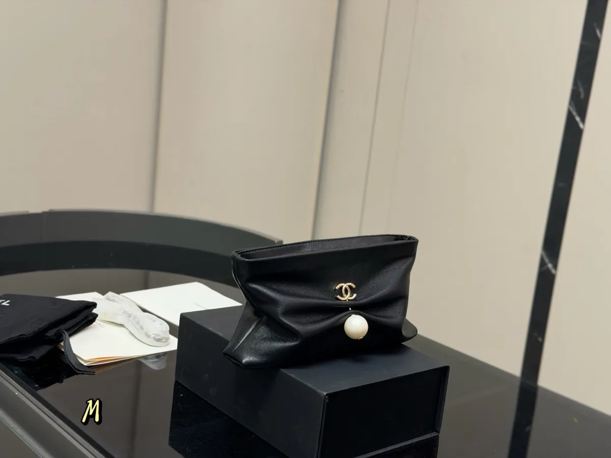 Chanel Pearl Detail Clutch Bag - 23 × 14 cm — source photograph 1 of 3