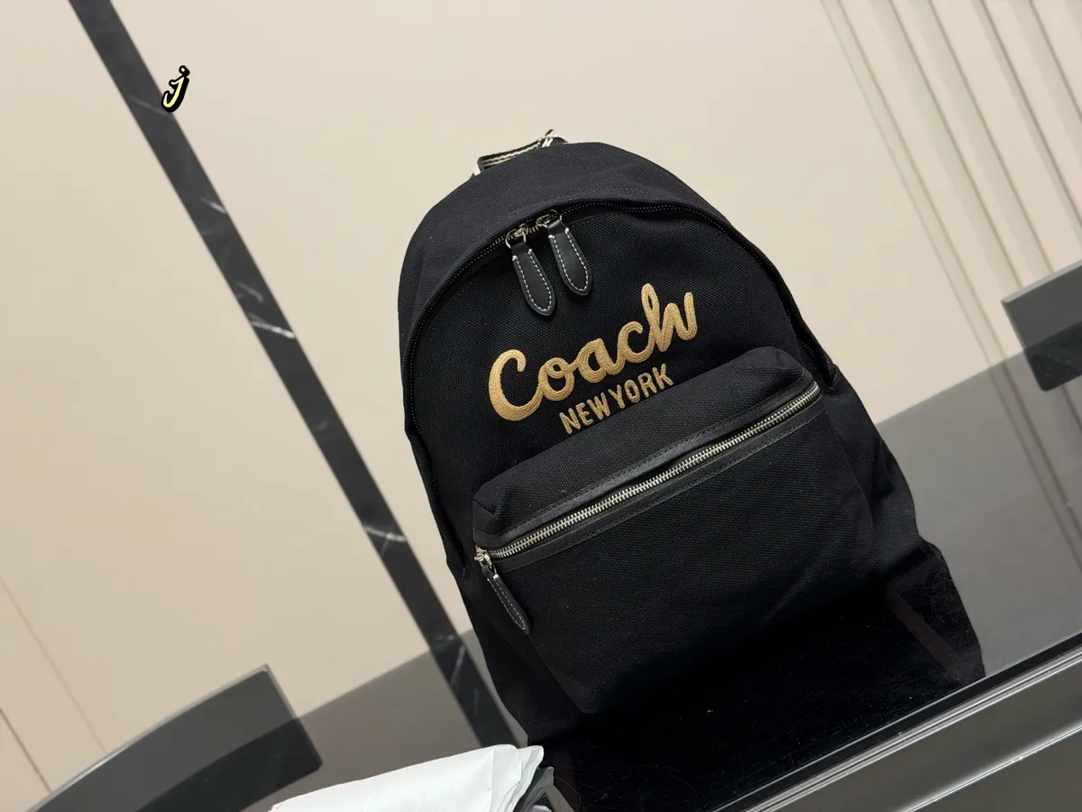 Coach Embroidered Canvas Backpack - 33 × 37 cm — source photograph 1 of 3