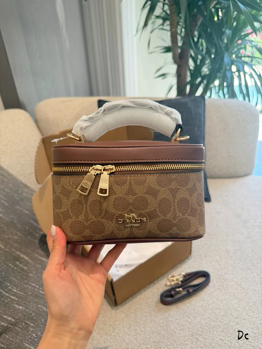 Coach Monogram Handbag — source photograph 1 of 3
