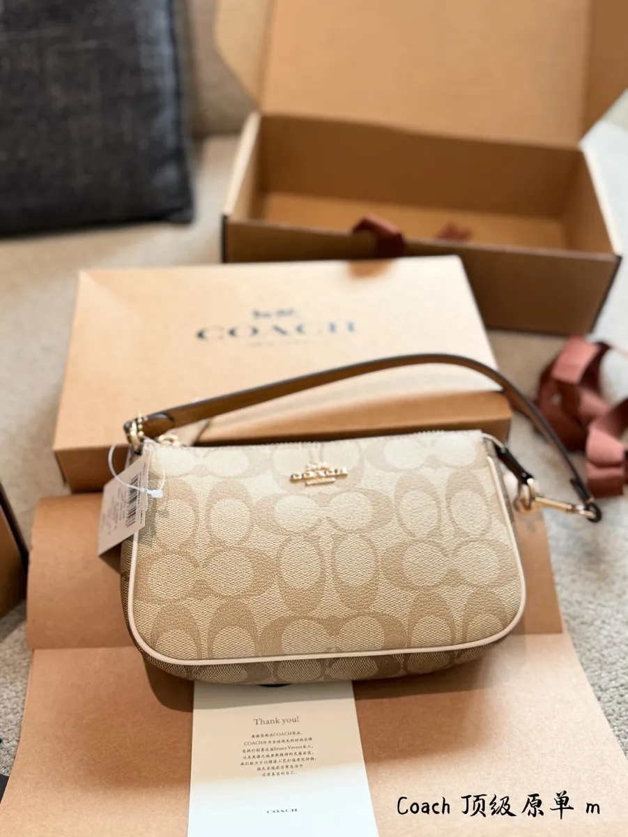 Coach Nolita Monogram Crossbody Bag - 19 × 11.5 × 5 cm — source photograph 1 of 3