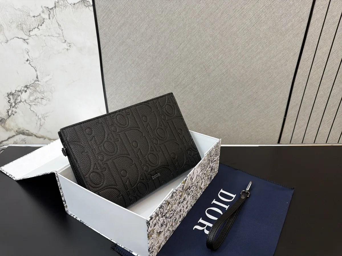 Dior Clutch Bag - 27 × 19 cm — source photograph 1 of 3