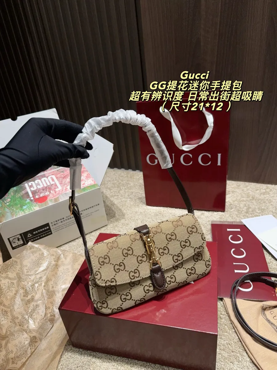 Gucci Canvas Top Handle Bag — source photograph 1 of 3