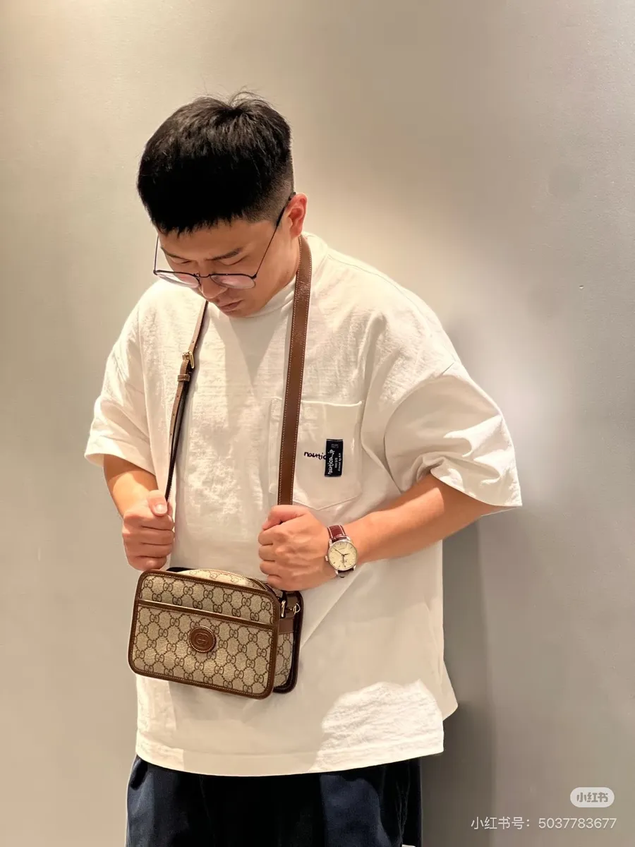 Gucci Monogram Clutch Bag — source photograph 1 of 3