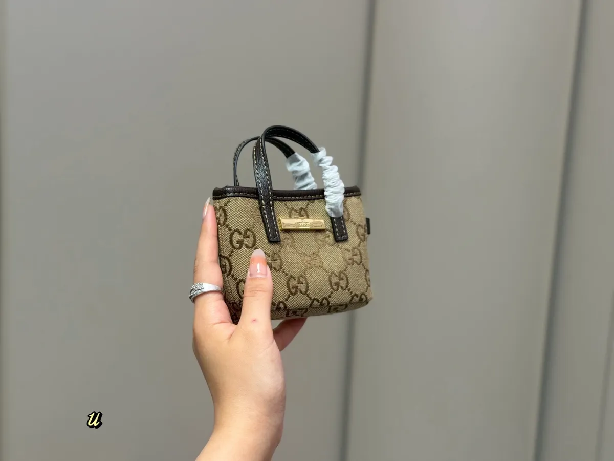 Gucci Monogram Mini Bag - 10.9 cm — source photograph 1 of 3
