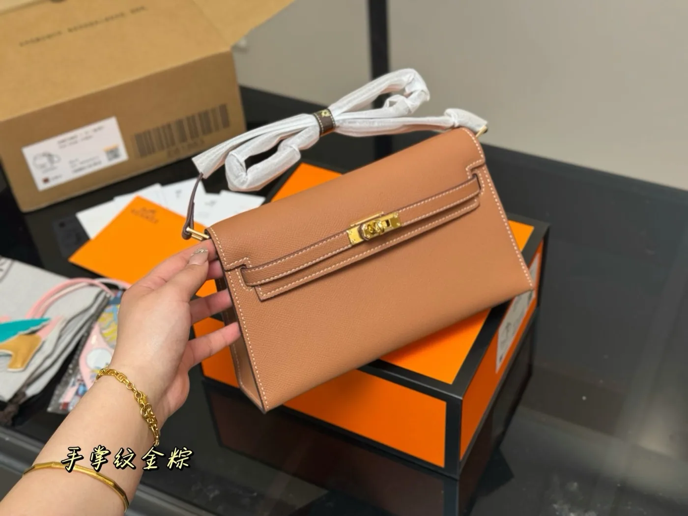 Hermès Kelly Shoulder Bag, tan — front and handle