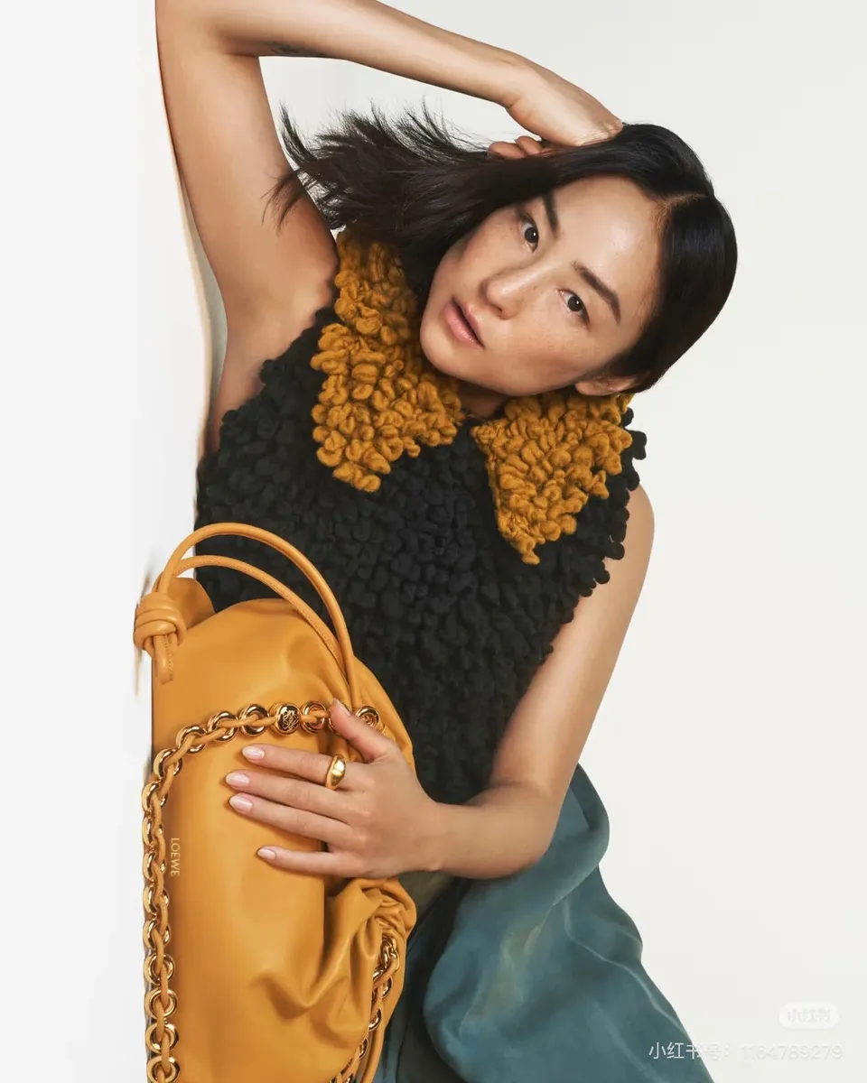 Loewe Woven Strap Clutch Bag — source photograph 1 of 3