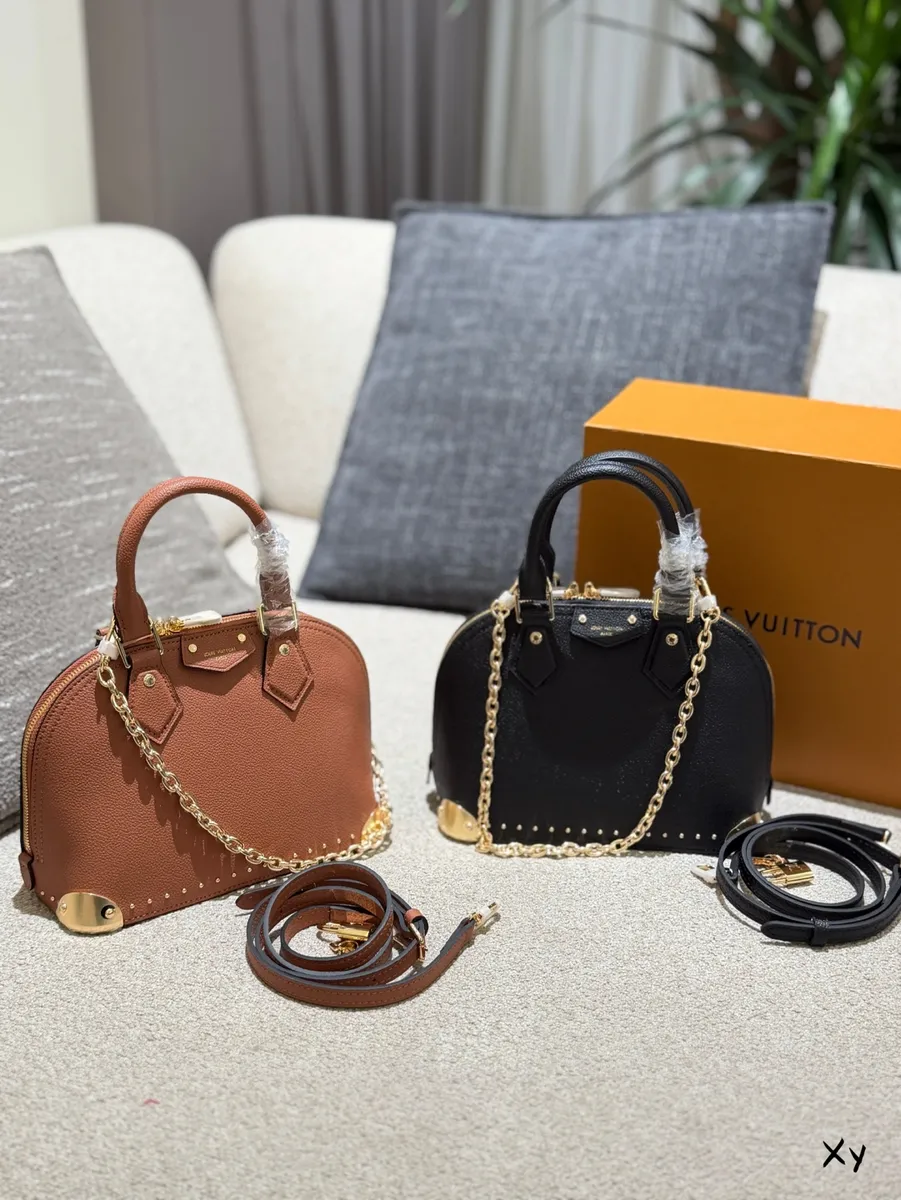 Louis Vuitton Alma Chain Studded Crossbody Bag - 23 cm — source photograph 1 of 3