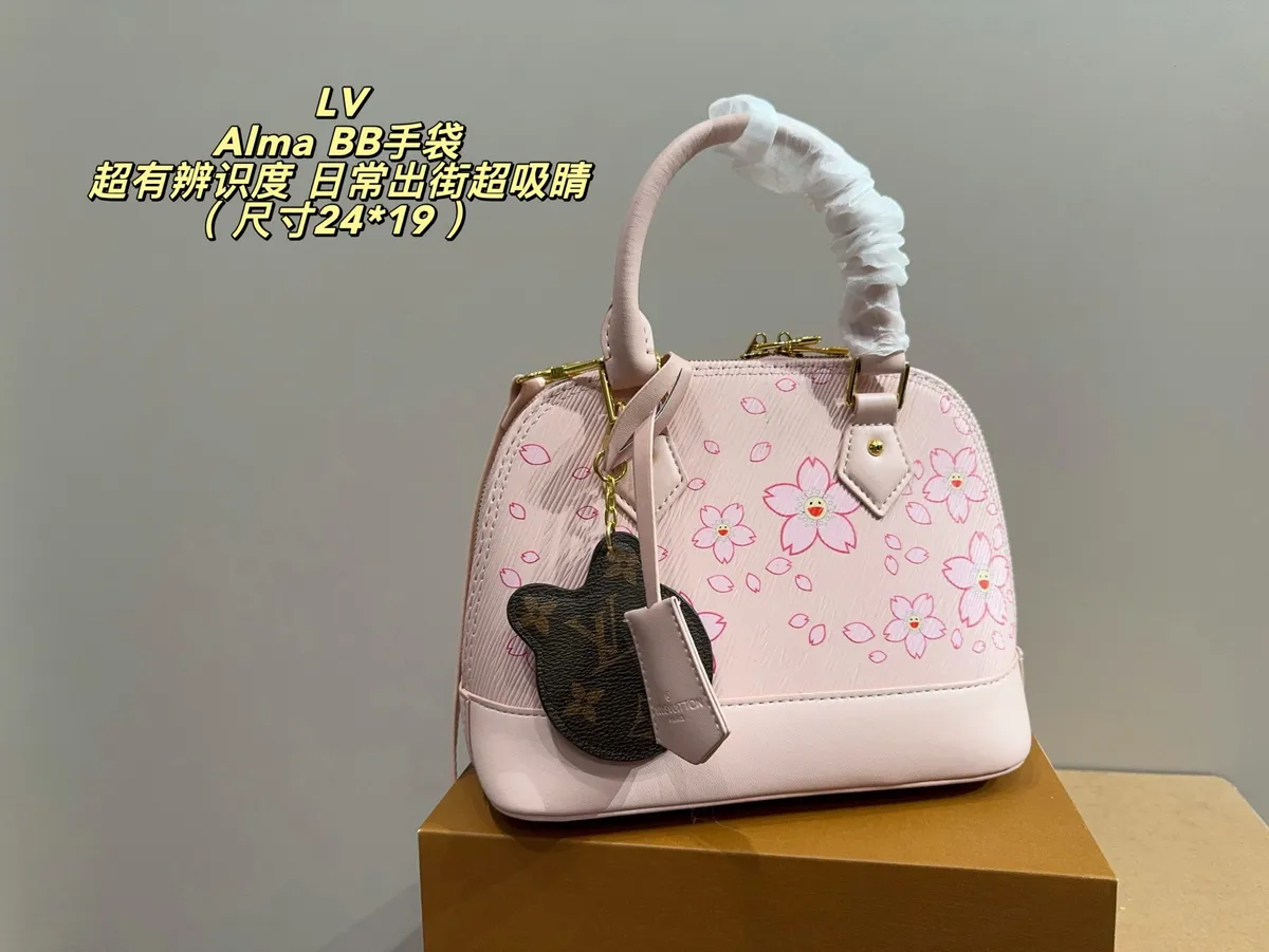 Louis Vuitton Alma Crossbody Bag — source photograph 1 of 3