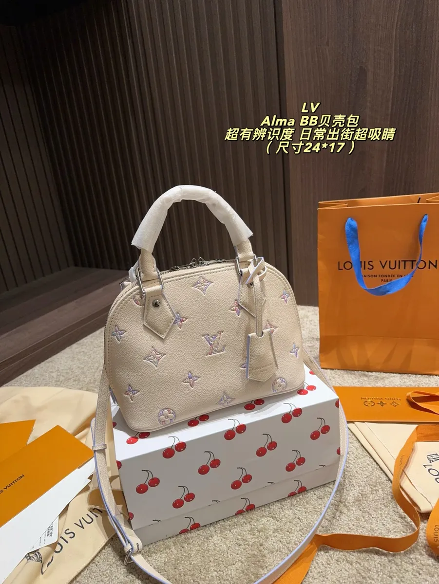 Louis Vuitton Alma Denim Embroidered Satchel Bag — source photograph 1 of 3