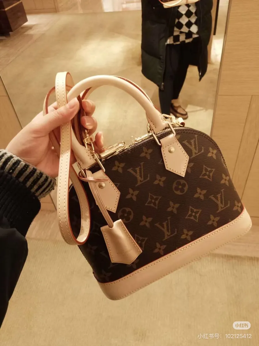 Louis Vuitton Alma Monogram Crossbody Bag — source photograph 1 of 3