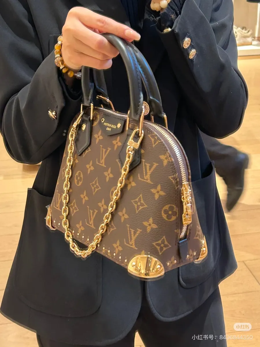 Louis Vuitton Alma Monogram Handbag — source photograph 1 of 3