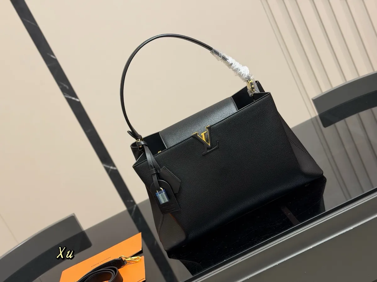 Louis Vuitton Capucines Monogram Flap Handbag - 38 × 23 cm — source photograph 1 of 3