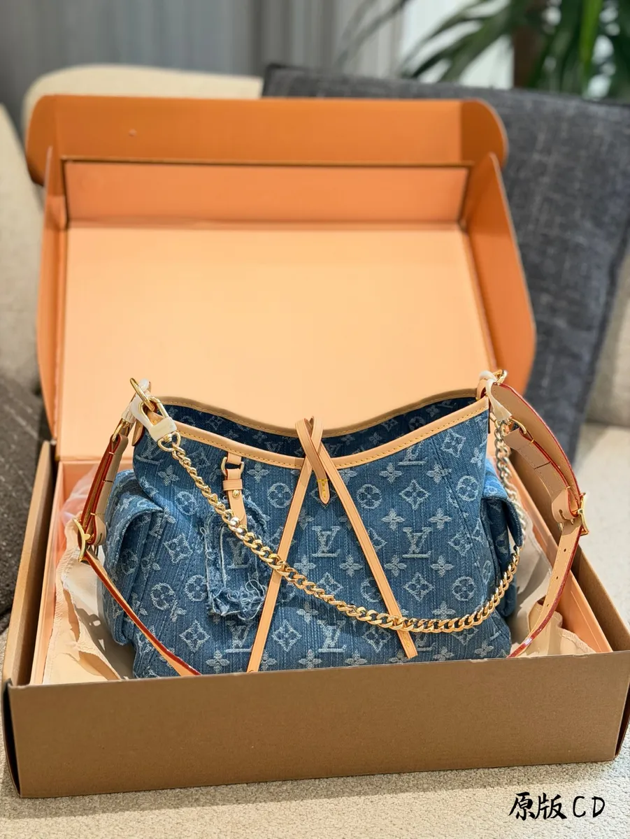 Louis Vuitton CarryAll Denim Monogram Crossbody Bag - 30 cm — source photograph 1 of 3