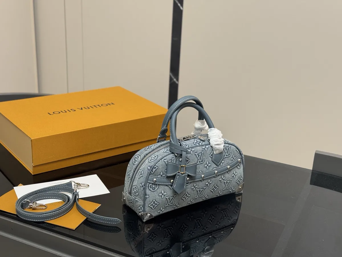 Louis Vuitton Keepall Denim Satchel Bag - 27 × 14 cm — source photograph 1 of 3