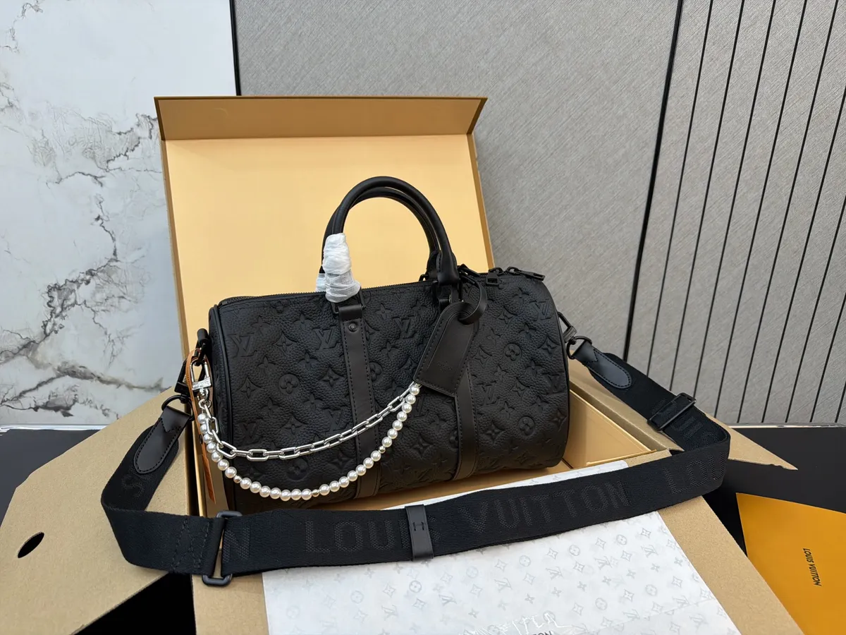 Louis Vuitton Keepall Monogram Travel Bag - 35 cm — source photograph 1 of 3