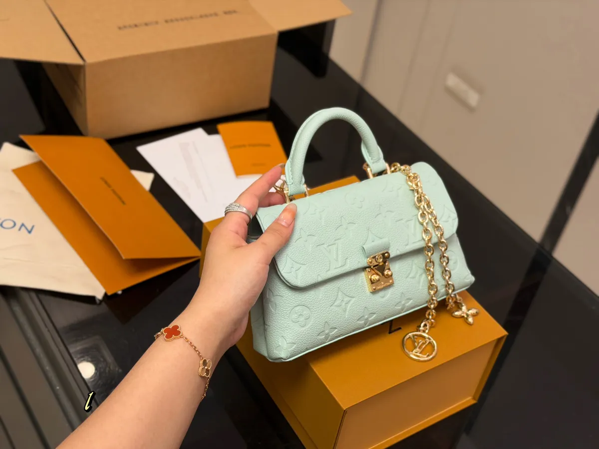 Louis Vuitton Nano Chain Mini Bag - 21 × 11 cm — source photograph 1 of 3