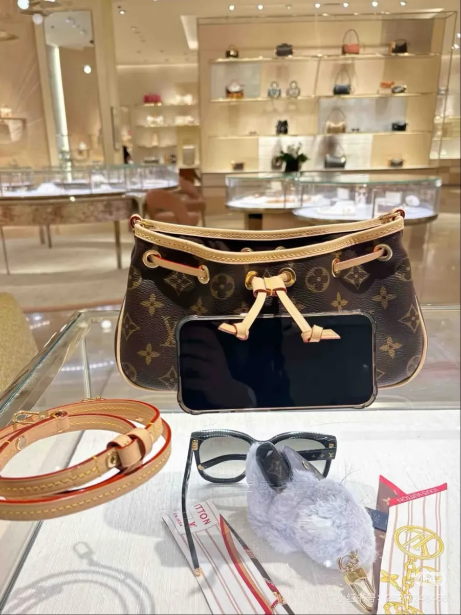 Louis Vuitton Nano Handbag — source photograph 1 of 3