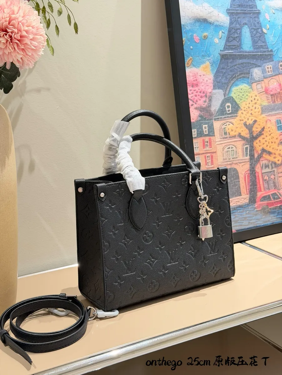 Louis Vuitton OnTheGo Monogram Chain Crossbody Bag - 19 × 11.5 × 25 cm — source photograph 1 of 3