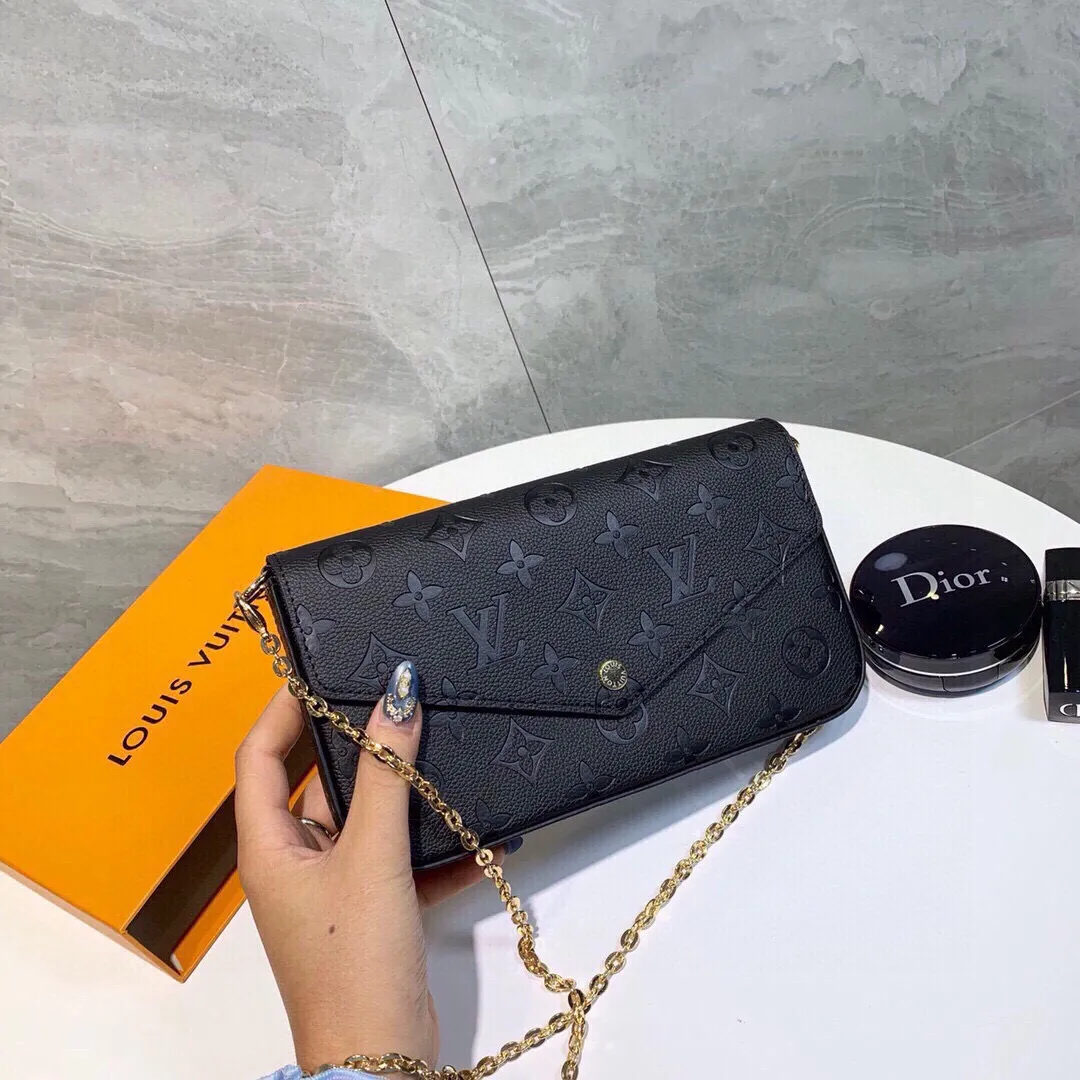 Louis Vuitton Pochette Monogram Top Handle Bag — source photograph 1 of 3