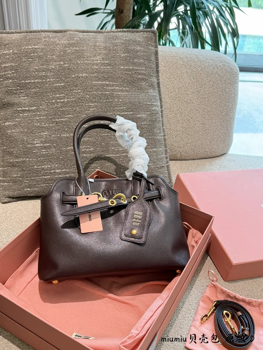 Miu Miu Aventure Canvas Top Handle Bag — source photograph 1 of 3