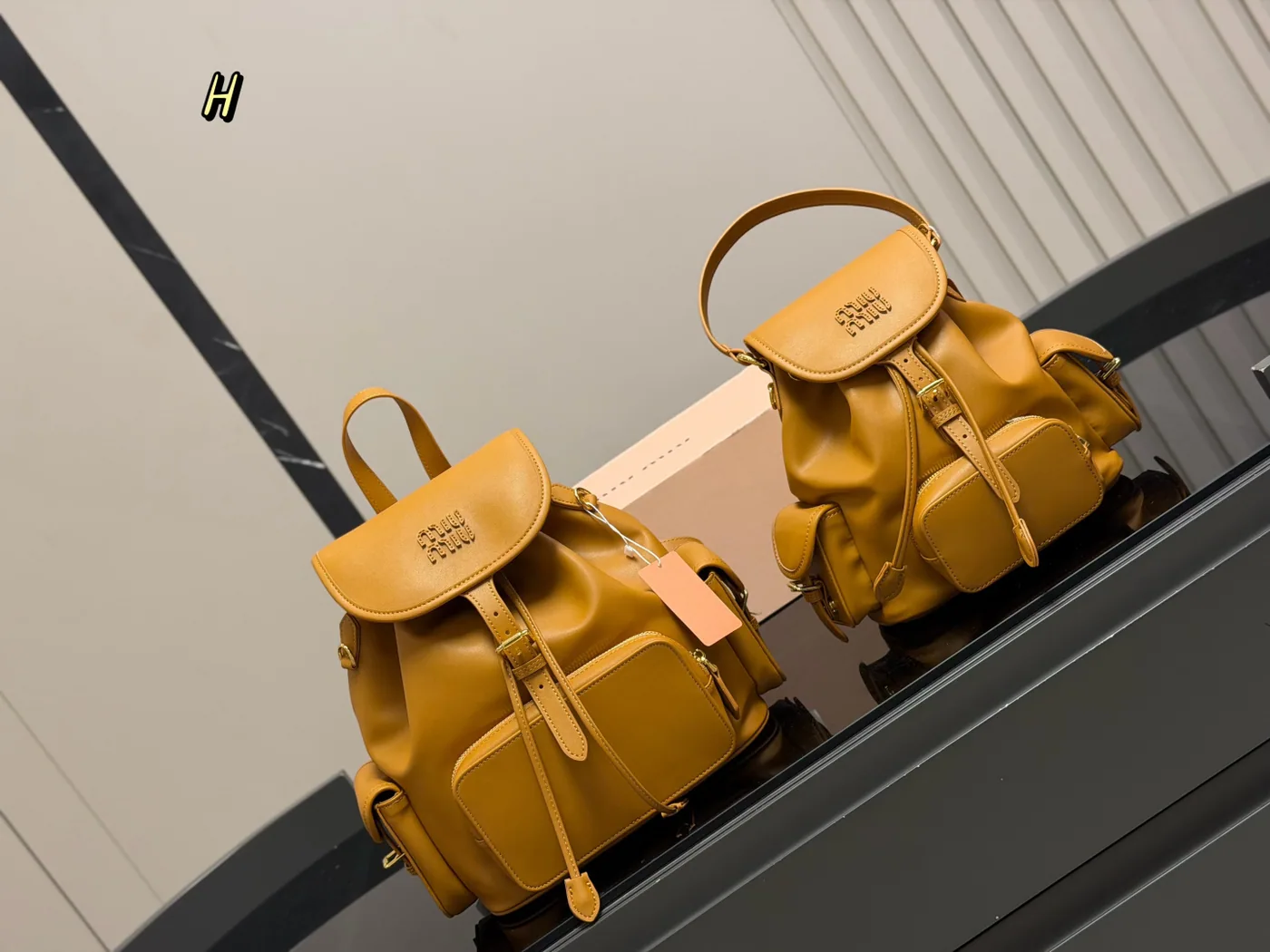 Miu Miu Buckle-Pocket Backpack, ochre — size comparison