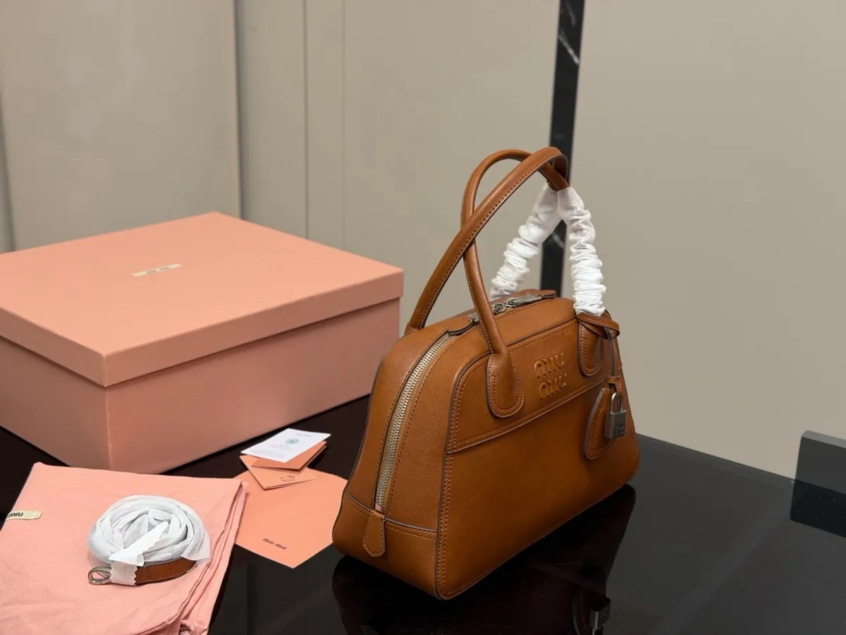 Miu Miu Crossbody Bag - 32 × 20 cm — source photograph 1 of 3