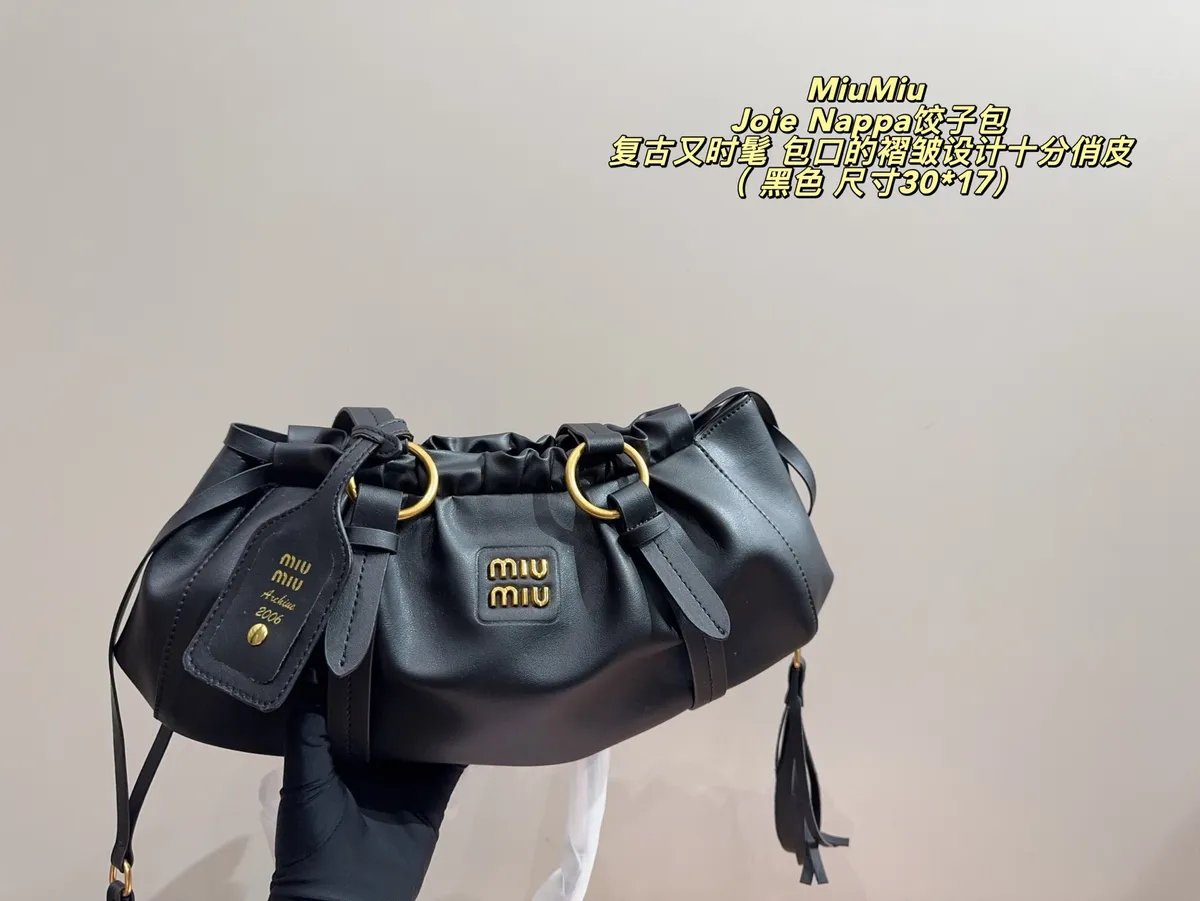 Miu Miu Joie Drawstring Satchel Bag — source photograph 1 of 3