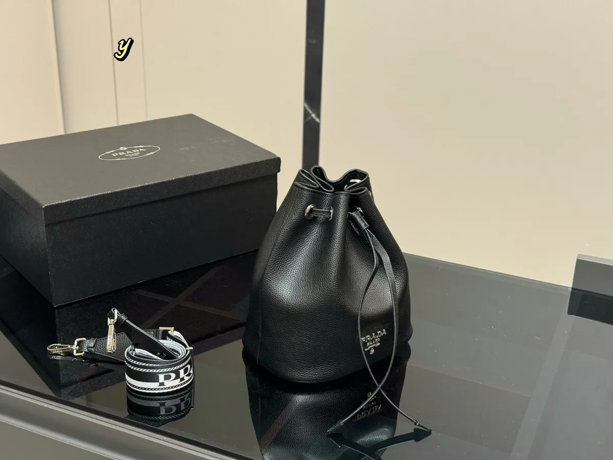 Prada Drawstring Bucket Bag - 21 × 23 cm — source photograph 1 of 3