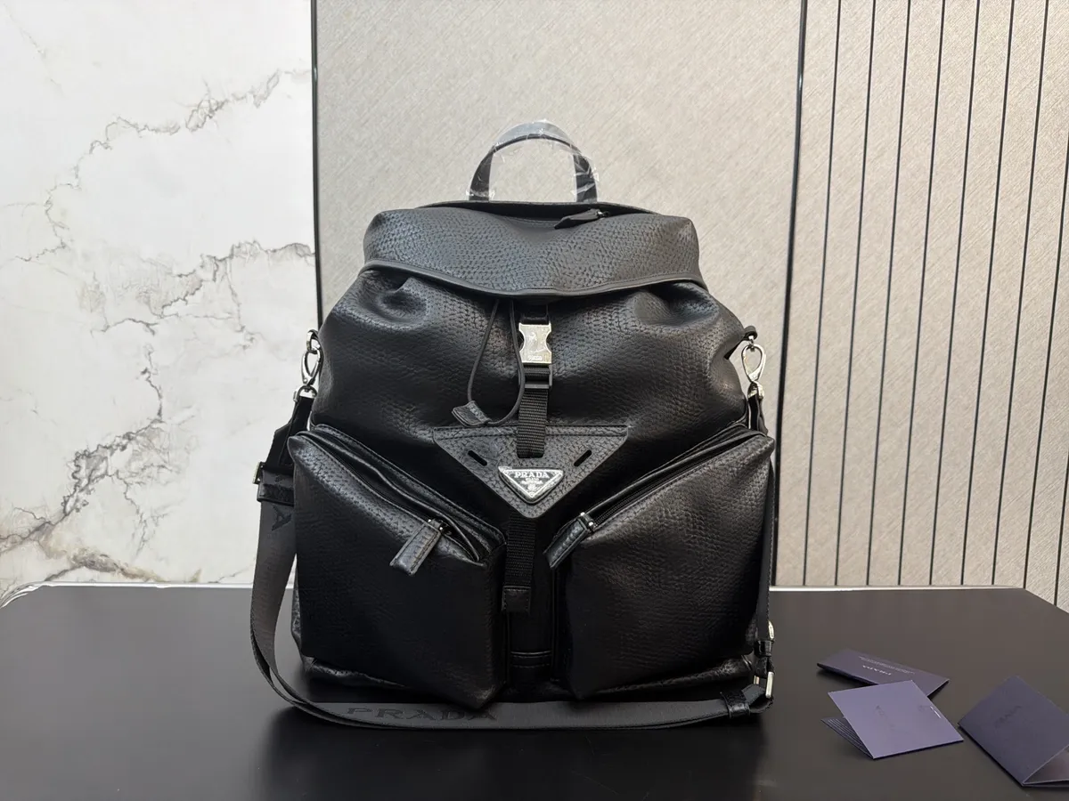 Prada Re-Nylon Drawstring Backpack - 38 × 42 cm — source photograph 1 of 3