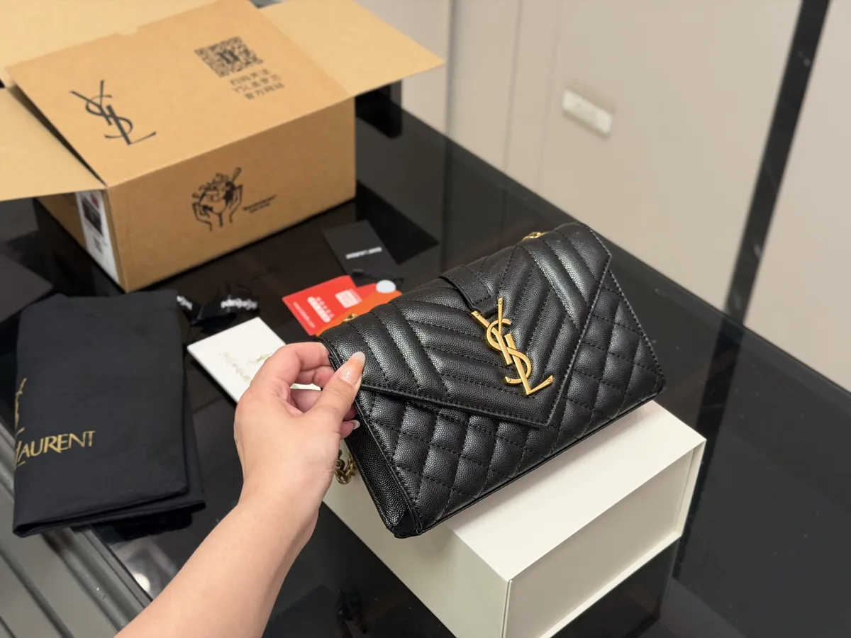Saint Laurent Envelop Quilted Check Handbag - 21 × 13 cm — source photograph 1 of 3