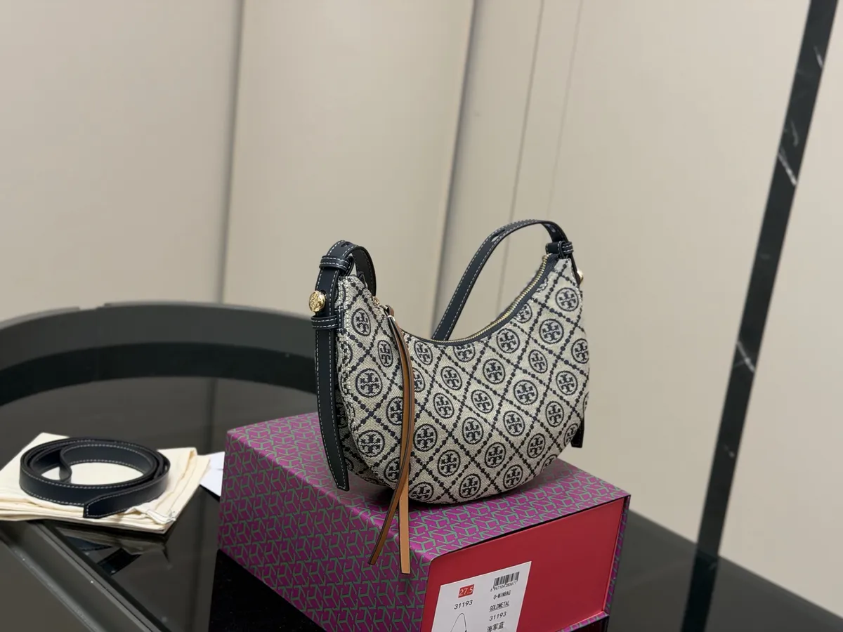 Tory Burch Romy Monogram Crossbody Bag - 26 × 14 cm — source photograph 1 of 3